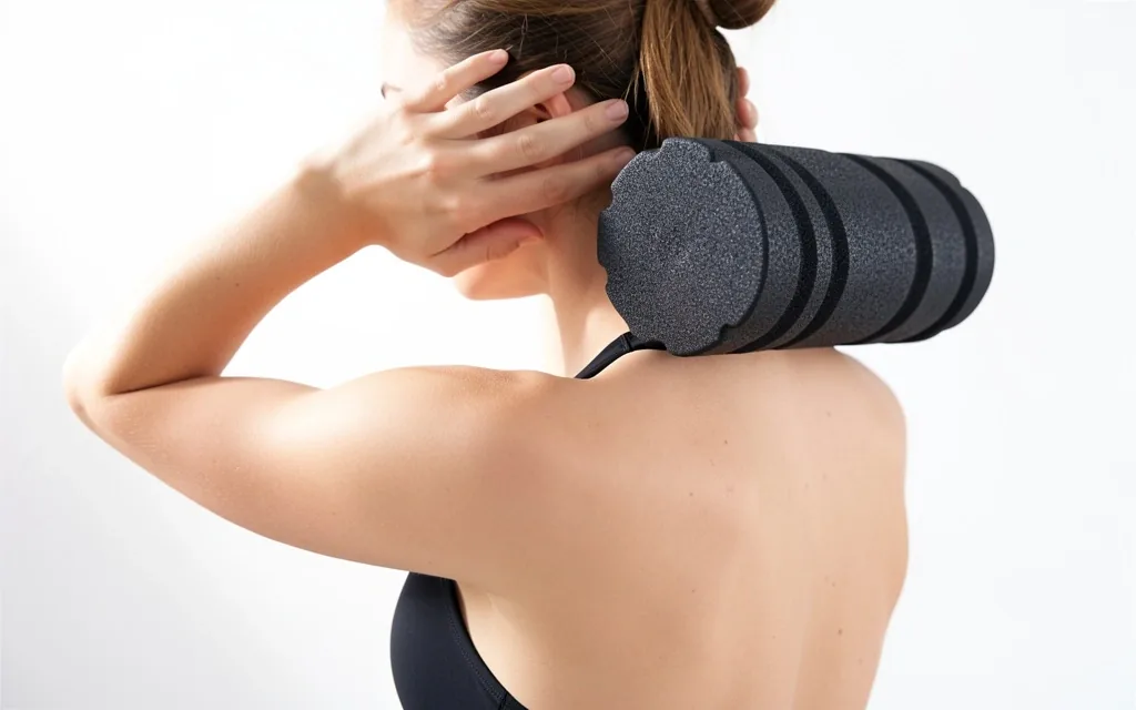 Person using a foam roller on their upper back